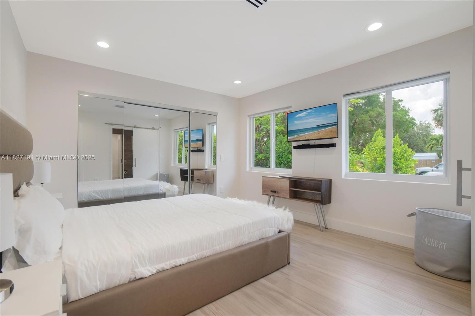 Biscayne Park Biscayne Park, FL 33161 - Photo 35 of 45 a bedroom with a large bed and a large window