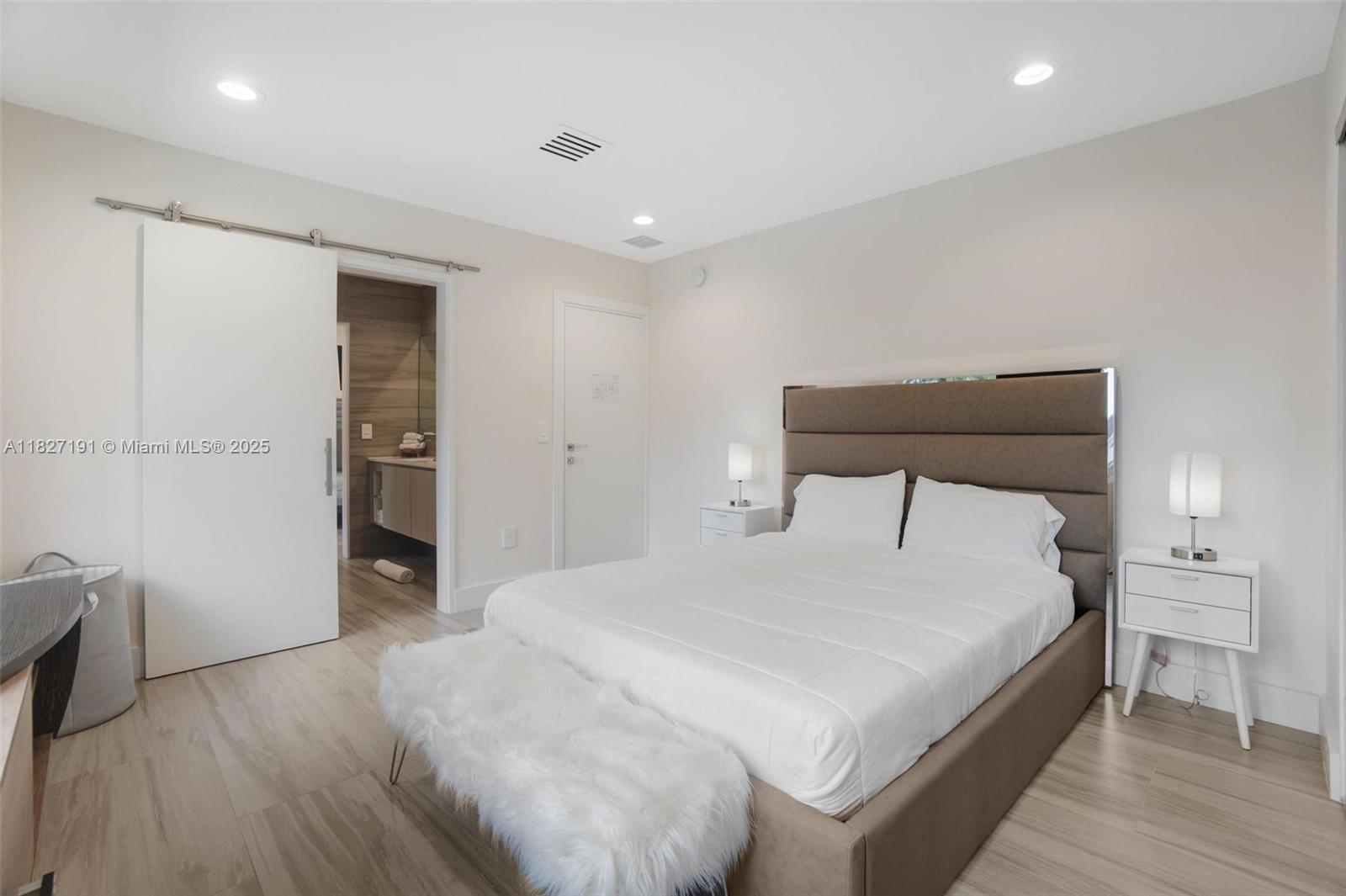 Biscayne Park Biscayne Park, FL 33161 - Photo 36 of 45 a bedroom with a bed and a table