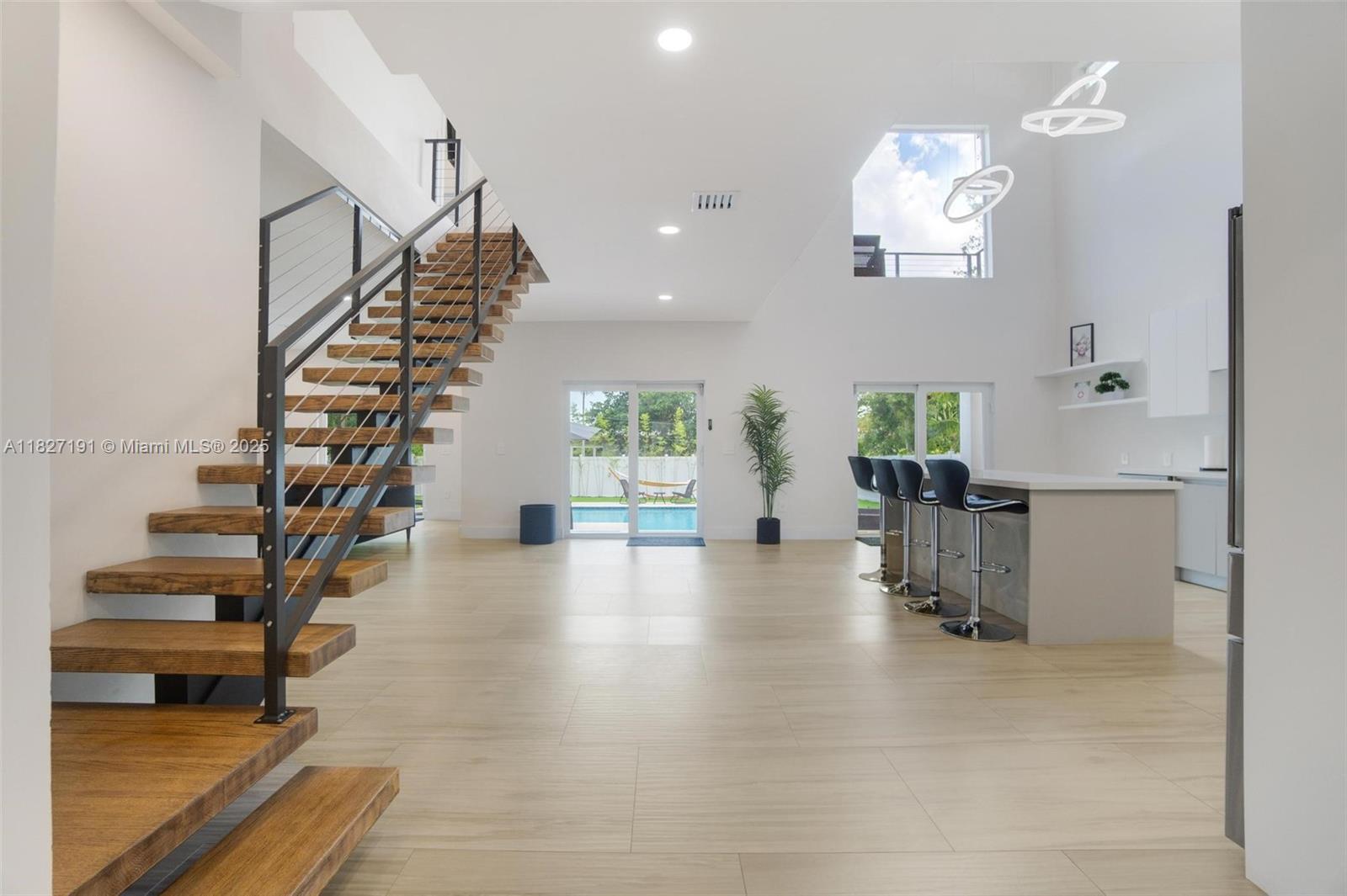 Biscayne Park Biscayne Park, FL 33161 - Photo 6 of 45 a view of entryway and hall with wooden floor
