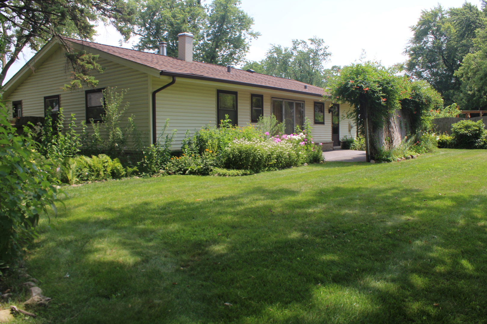 1060 Warwick Lane Elk Grove Village, IL 60007 - Photo 2 of 15 a view of a house with a yard and potted plants