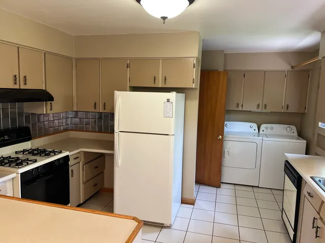 a bathroom with a glass door shower and a sink