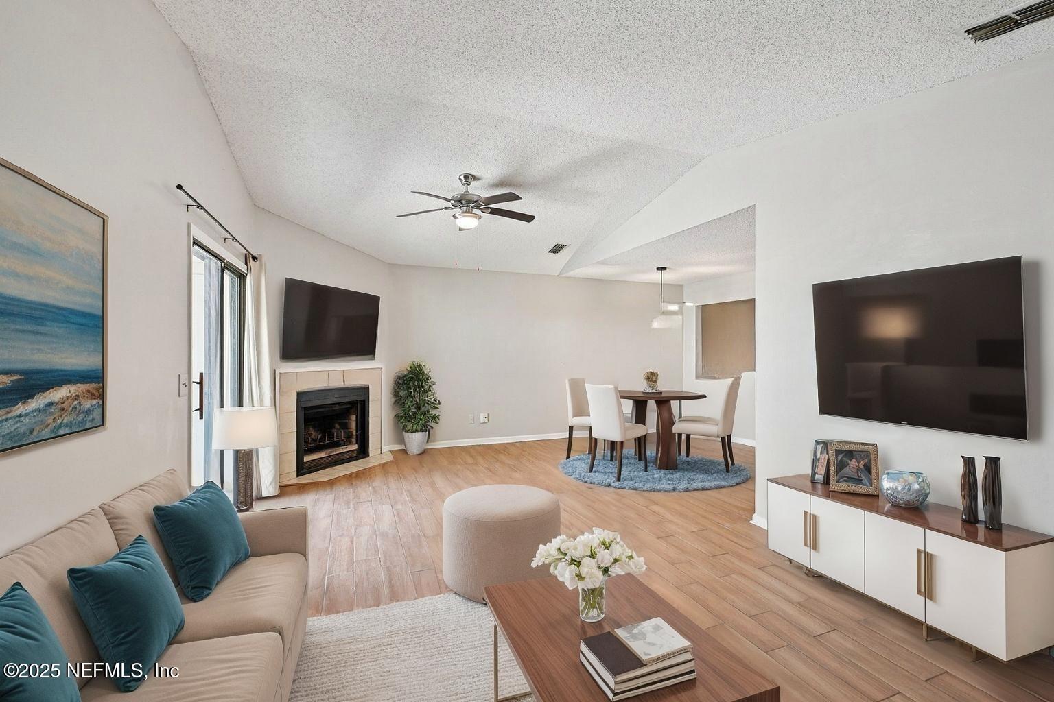 3801 Crown Point Road, Unit 1174 Jacksonville, FL 32257 - Photo 2 of 17 a living room with furniture and a flat screen tv