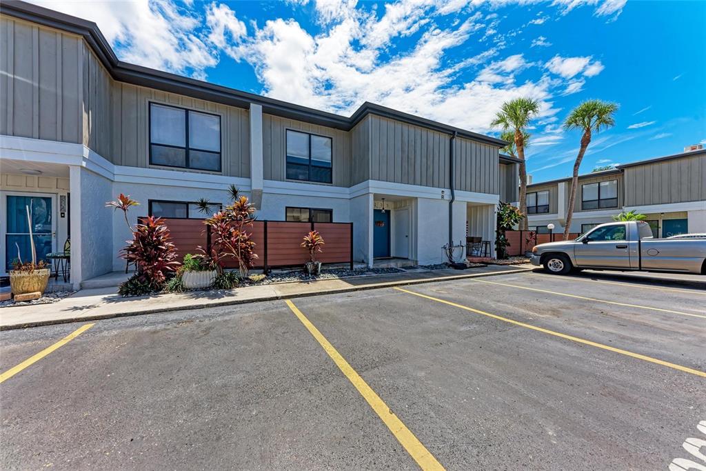 4001 South Beneva Road, Unit 335 Sarasota, FL 34233 - Photo 1 of 1 a view of a cars park in front of a building