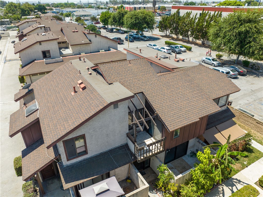8030 1/2 Harrison Street Paramount, CA 90723 - Photo 1 of 1 an aerial view of a house with outdoor space