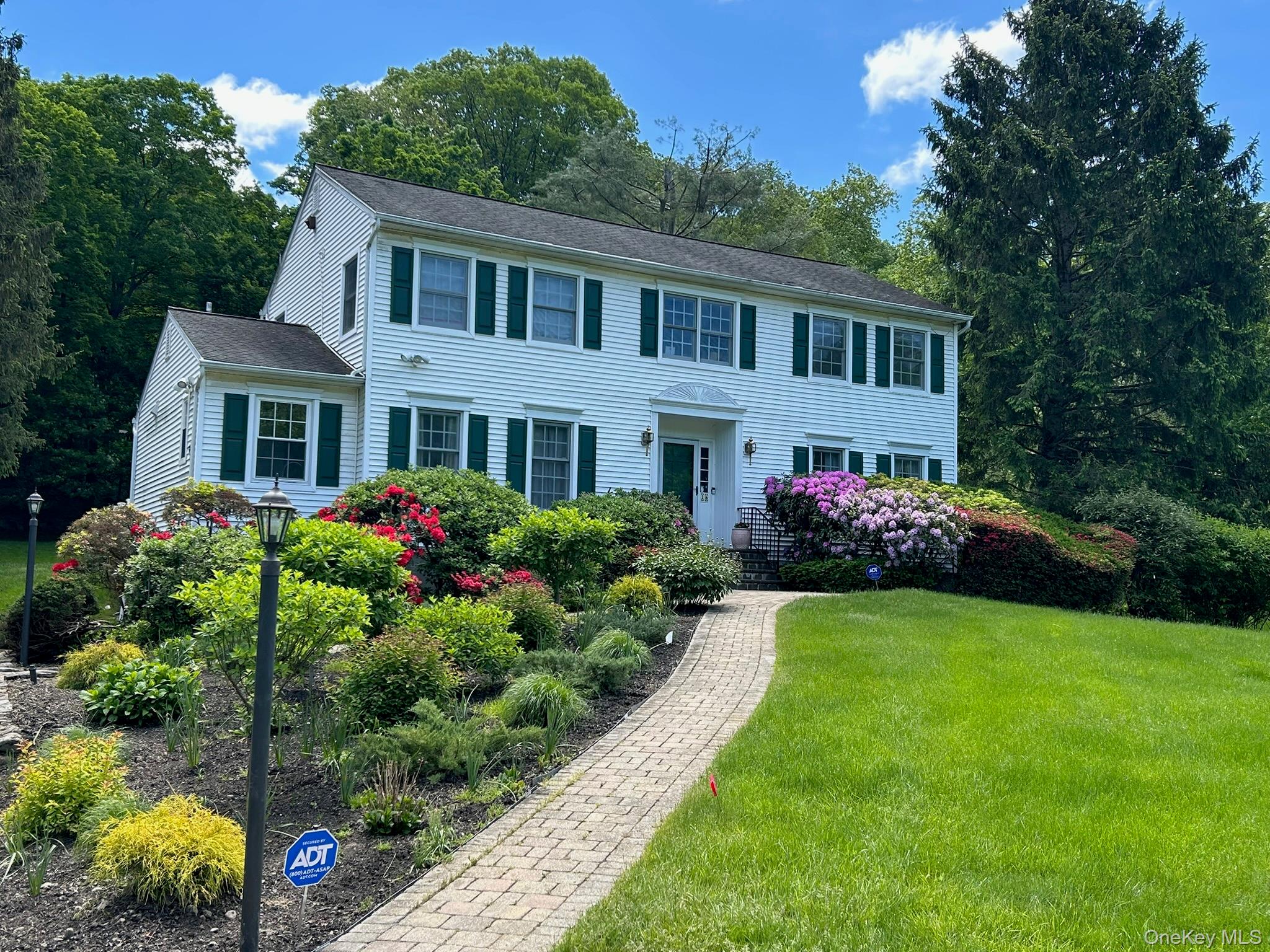 16 Fox Den Road Mount Kisco, NY 10549 - Photo 3 of 44 Gardens featuring flowering perennials, specimen shrubs, towering old growth trees, lush expansive front and back lawns