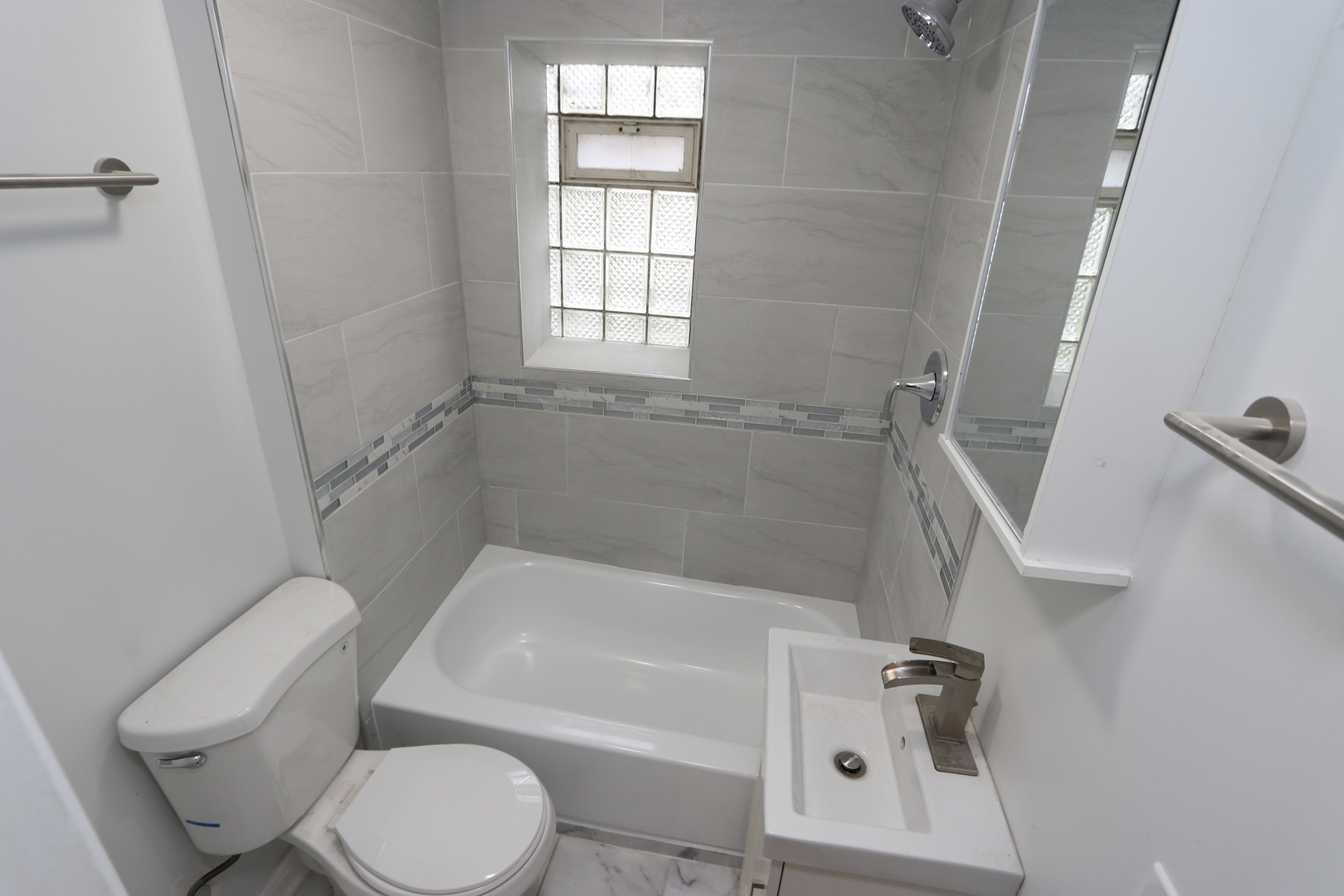 4621 South Laflin Street Chicago, IL 60609 - Photo 4 of 9 a white bath tub sitting next to a toilet