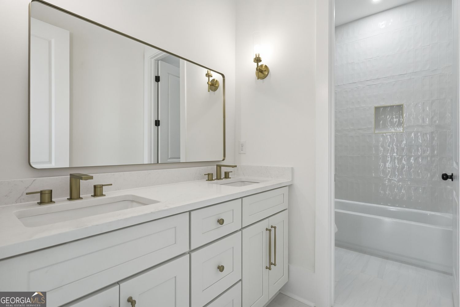 6625 Windvane Point Clermont, GA 30527 - Photo 11 of 45 a bathroom with a granite countertop sink mirror and double