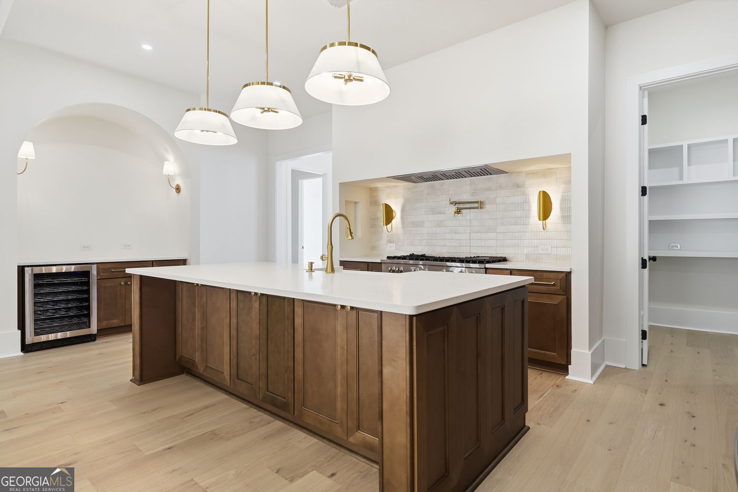 6625 Windvane Point Clermont, GA 30527 - Photo 15 of 45 a kitchen with a counter space a sink and cabinets