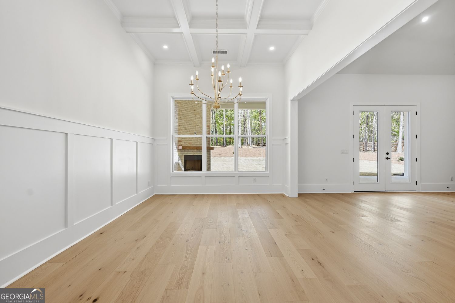 6625 Windvane Point Clermont, GA 30527 - Photo 20 of 45 wooden floor in an empty room with a window
