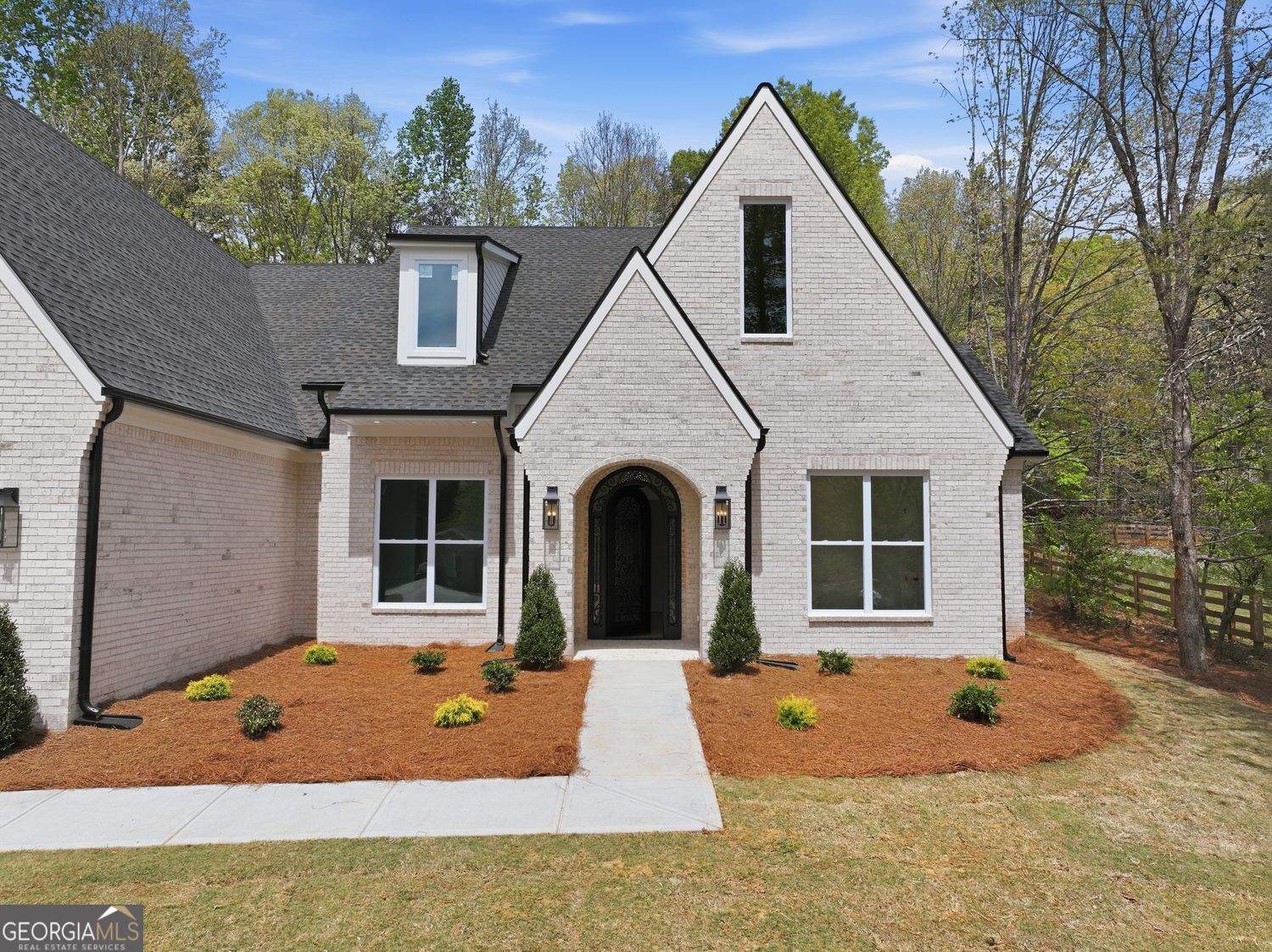 6625 Windvane Point Clermont, GA 30527 - Photo 2 of 45 a front view of a house with yard