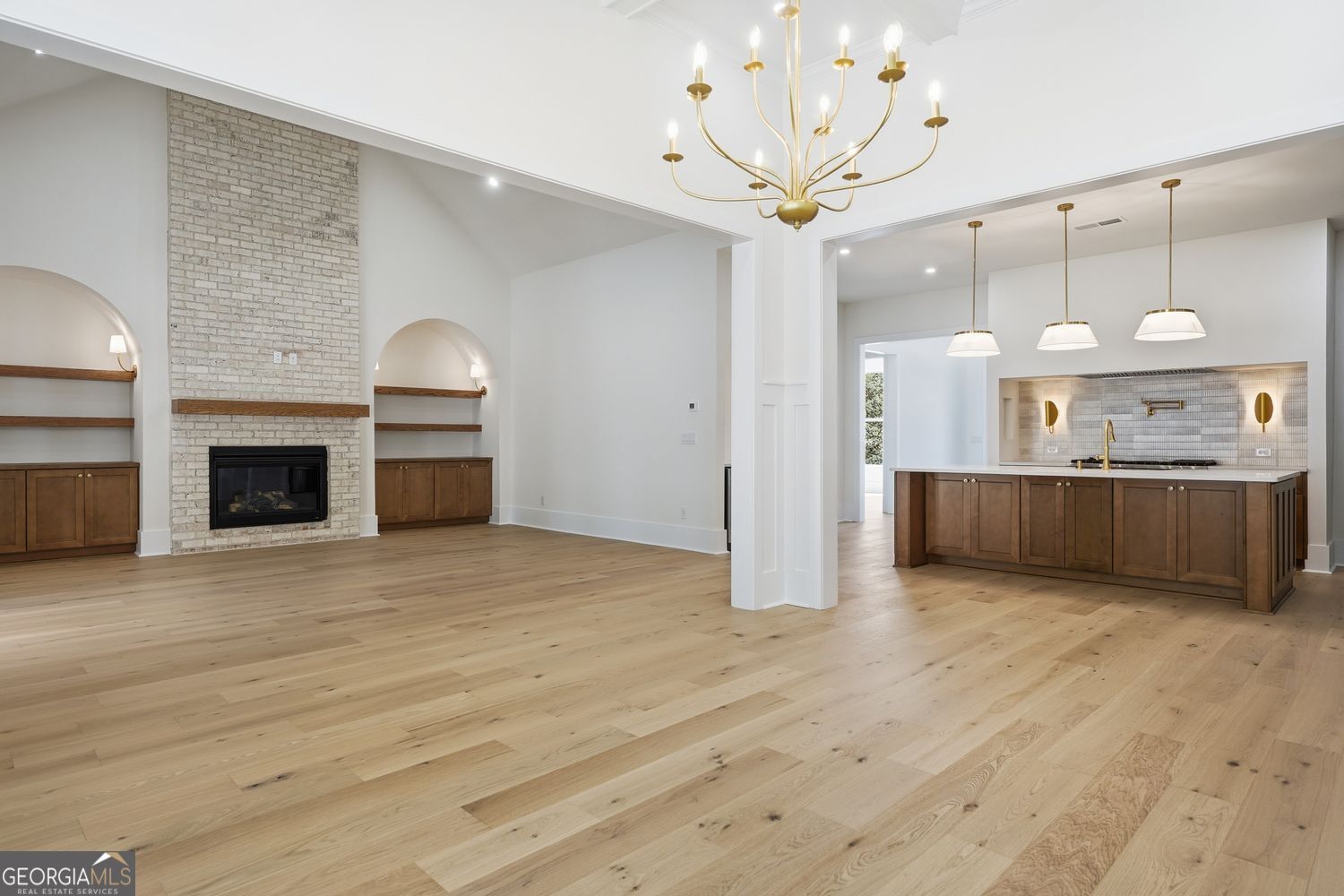 6625 Windvane Point Clermont, GA 30527 - Photo 21 of 45 a view of a kitchen with a sink and a stove top oven