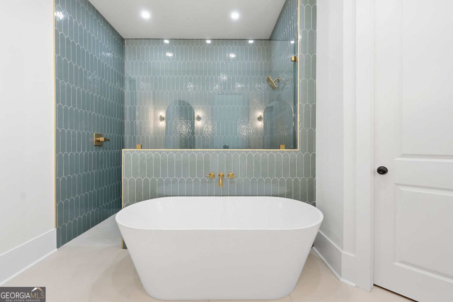 6625 Windvane Point Clermont, GA 30527 - Photo 27 of 45 a bathroom with a bathtub and shower