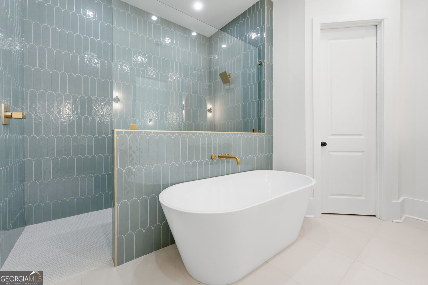 6625 Windvane Point Clermont, GA 30527 - Photo 29 of 45 a bathroom with a bathtub and shower