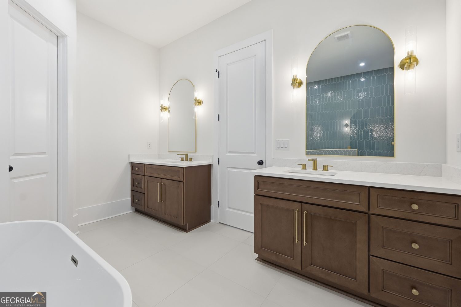 6625 Windvane Point Clermont, GA 30527 - Photo 31 of 45 a bathroom with a double vanity sink mirror and bathtub