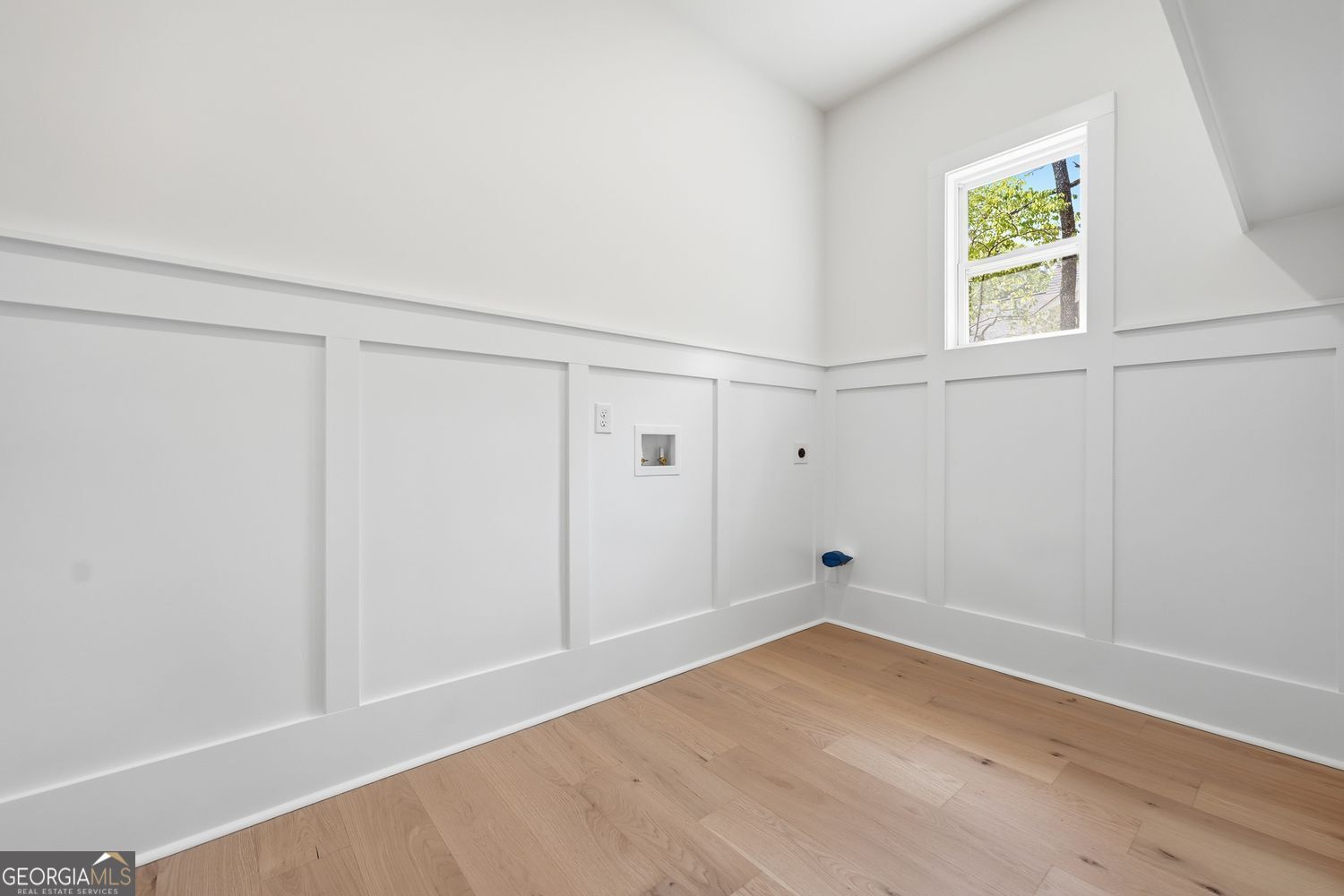 6625 Windvane Point Clermont, GA 30527 - Photo 33 of 45 wooden floor in an empty room with a window