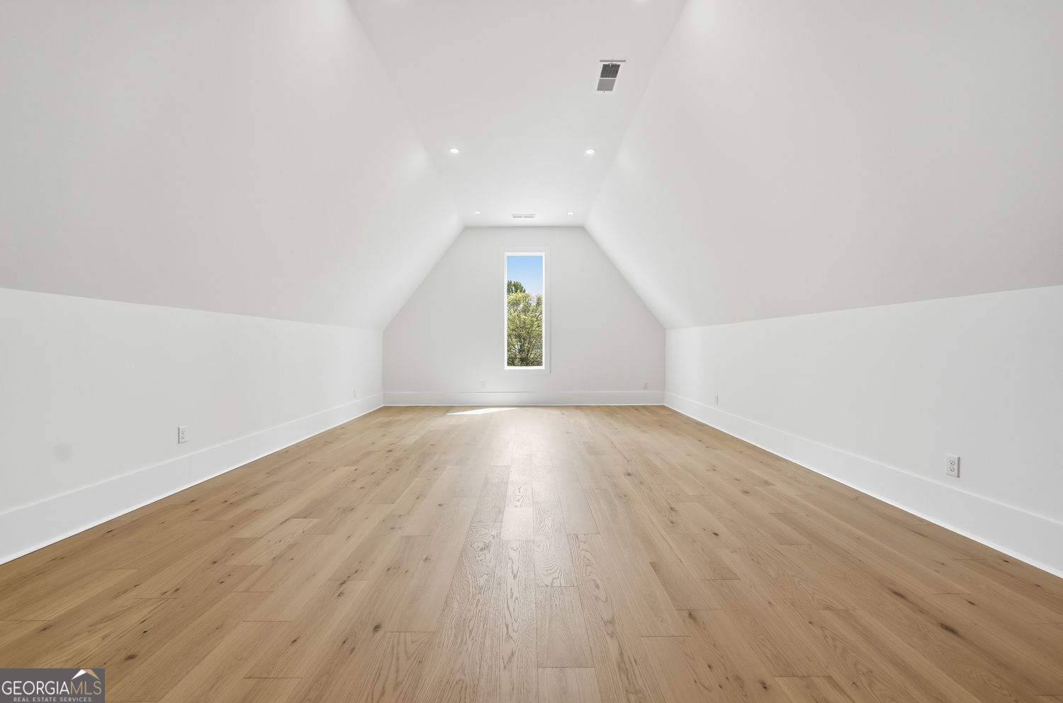 6625 Windvane Point Clermont, GA 30527 - Photo 34 of 45 an empty room with wooden floor and windows