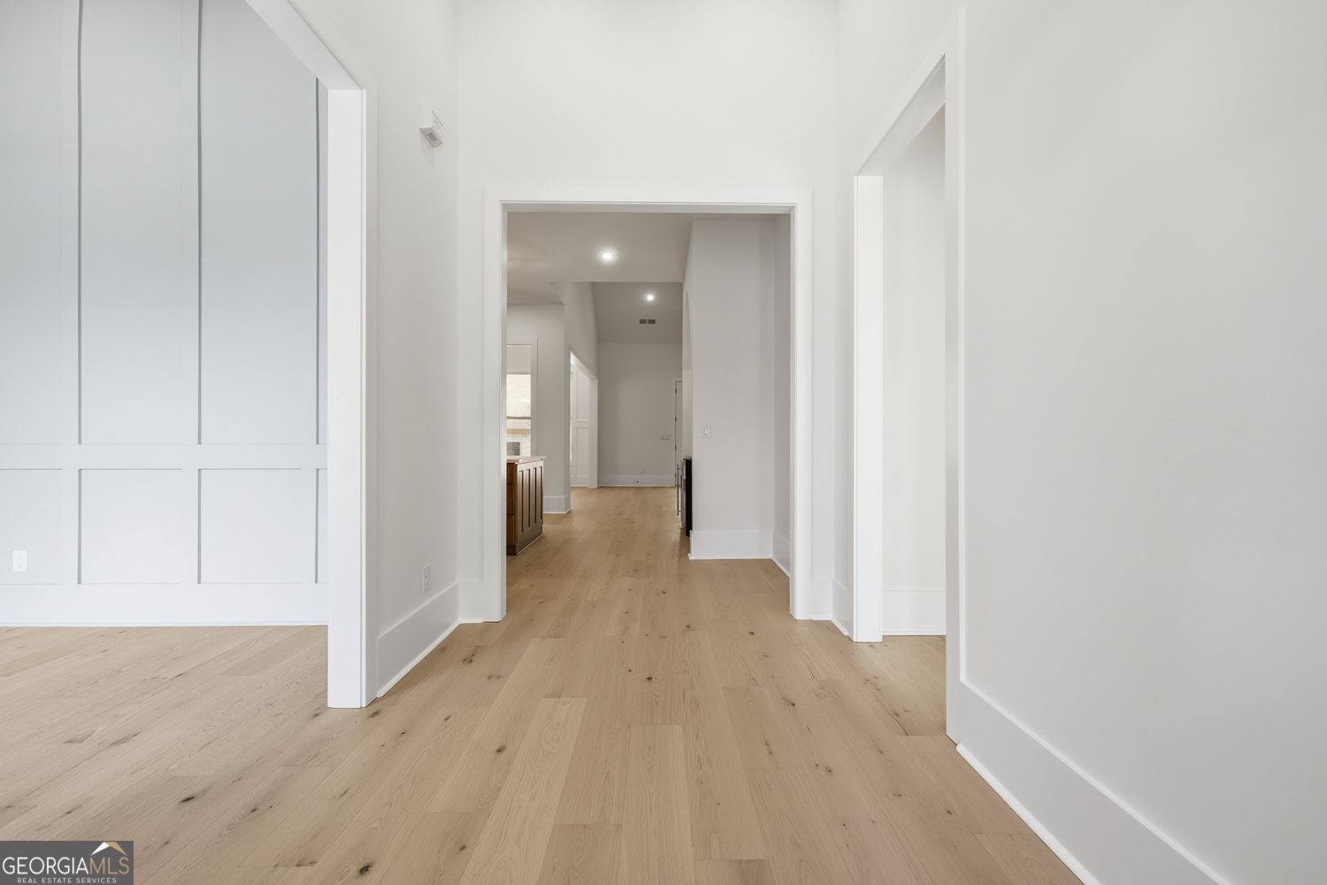 6625 Windvane Point Clermont, GA 30527 - Photo 37 of 45 a view of a hallway with wooden floor