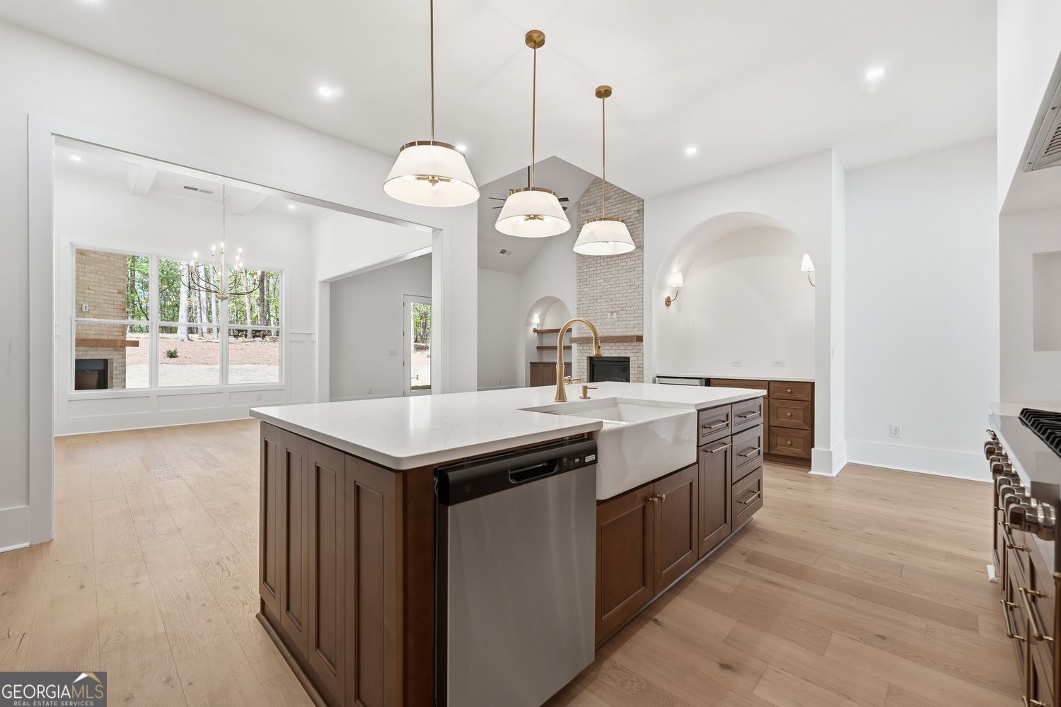 6625 Windvane Point Clermont, GA 30527 - Photo 39 of 45 a kitchen with a stove and a wooden floor