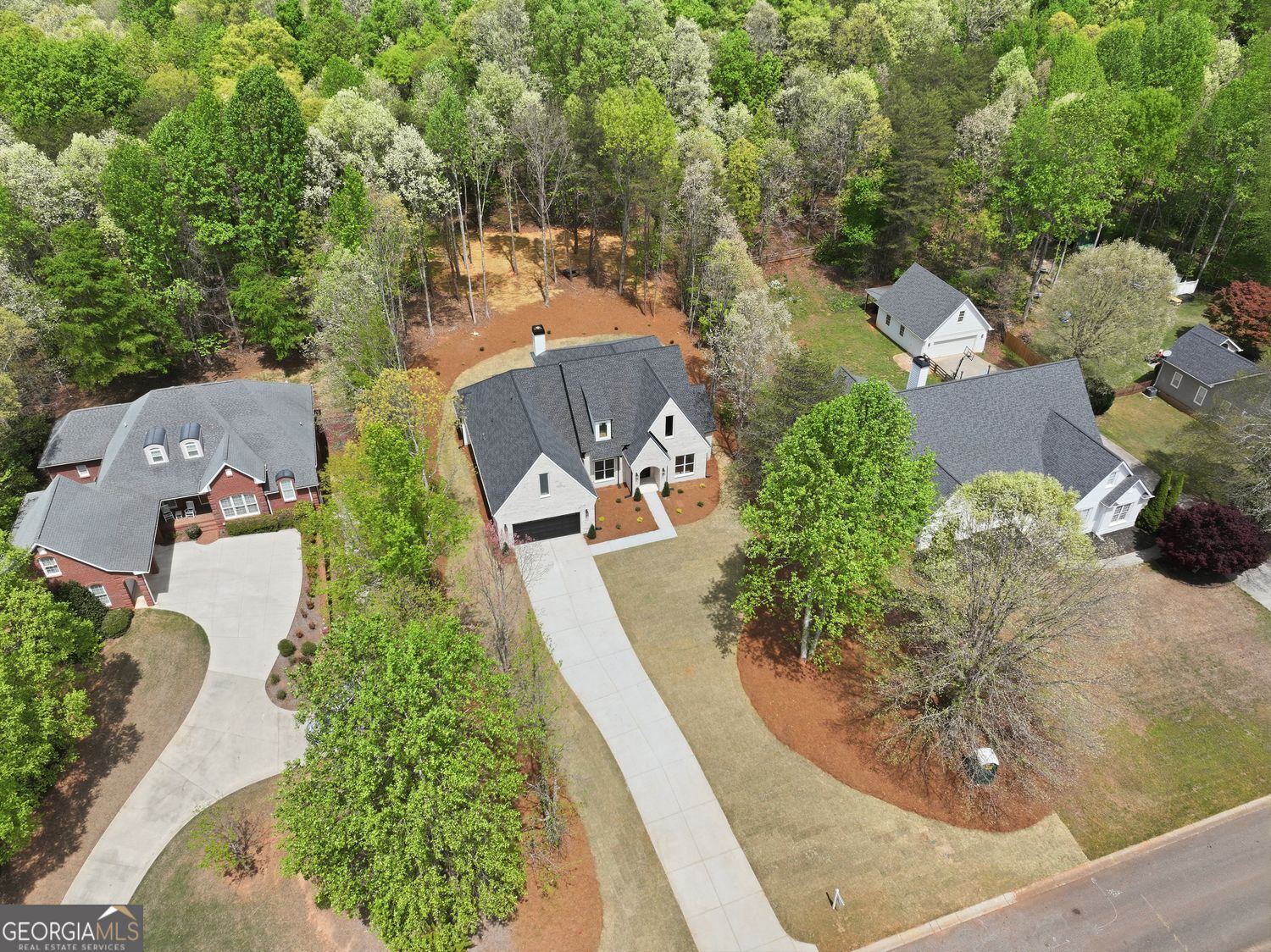 6625 Windvane Point Clermont, GA 30527 - Photo 4 of 45 an aerial view of a house with a yard and trees