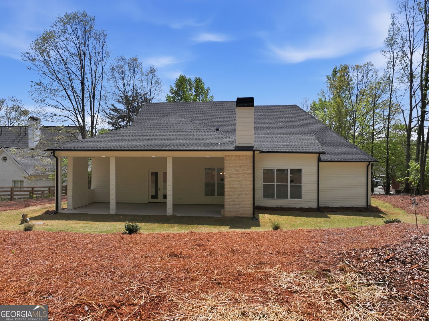 6625 Windvane Point Clermont, GA 30527 - Photo 45 of 45 a front view of a house with a yard and garage