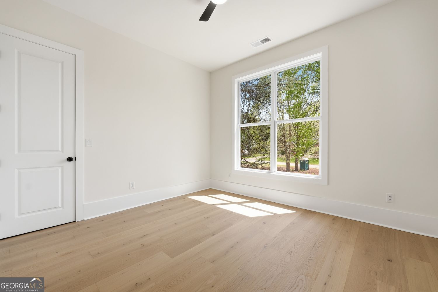 6625 Windvane Point Clermont, GA 30527 - Photo 9 of 45 an empty room with a window