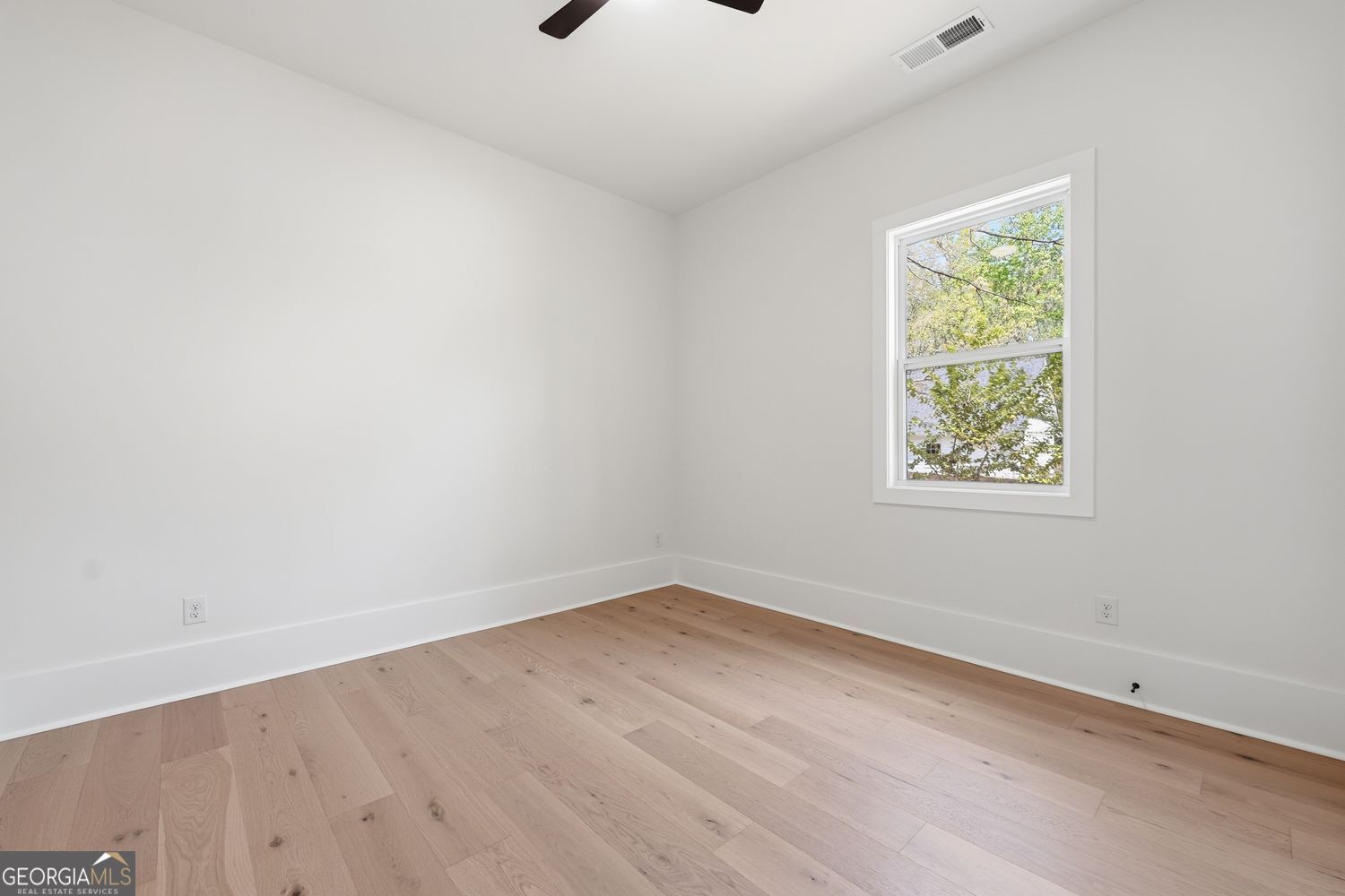 6625 Windvane Point Clermont, GA 30527 - Photo 10 of 45 an empty room with a window