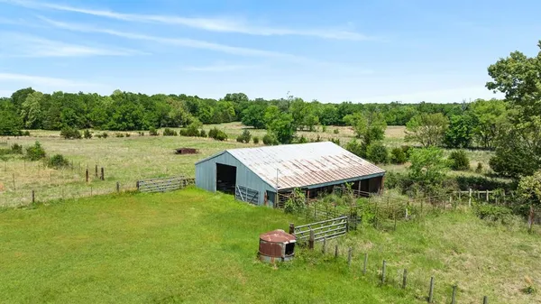 a view of a big yard with lots of green space