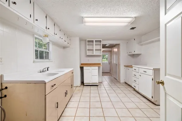 a large room with lots of wooden cabinets