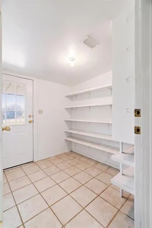 a room with furniture and window
