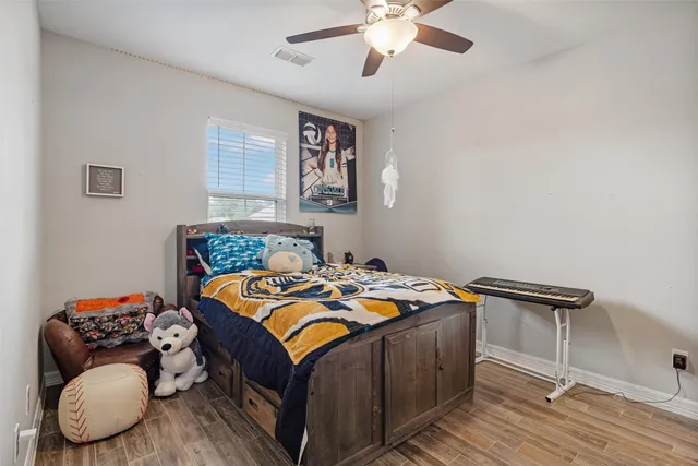 a bedroom with bed and a window