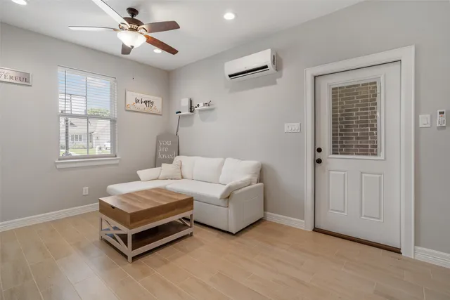a living room with furniture and a window