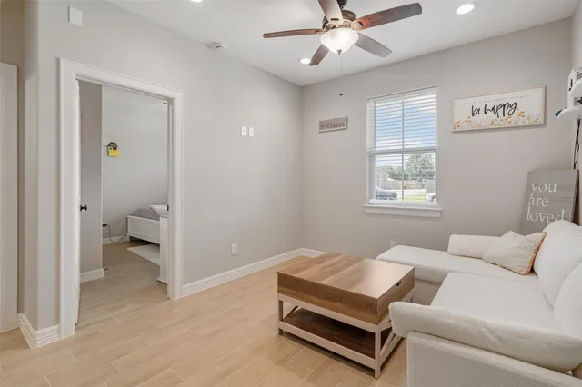 a living room with furniture and a window