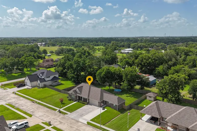 an aerial view of a house with a garden