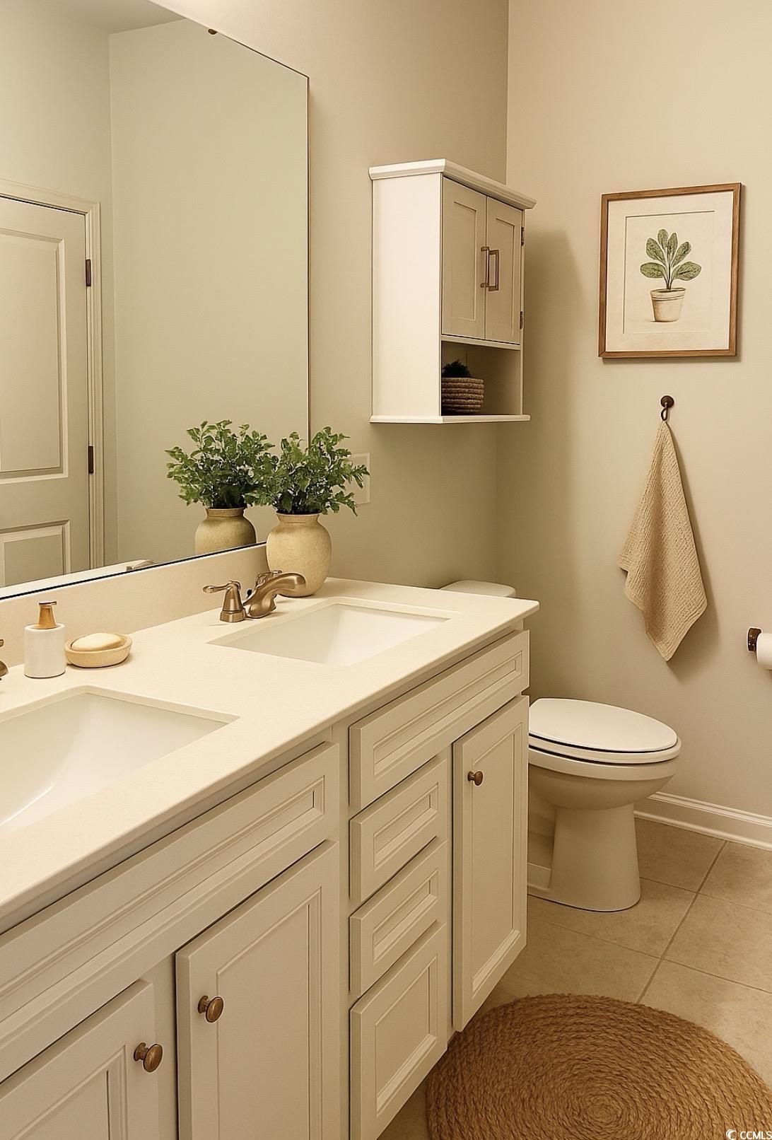 3320 Candytuft Drive Conway, SC 29526 - Photo 16 of 19 Bathroom with double vanity and light tile patterned floors