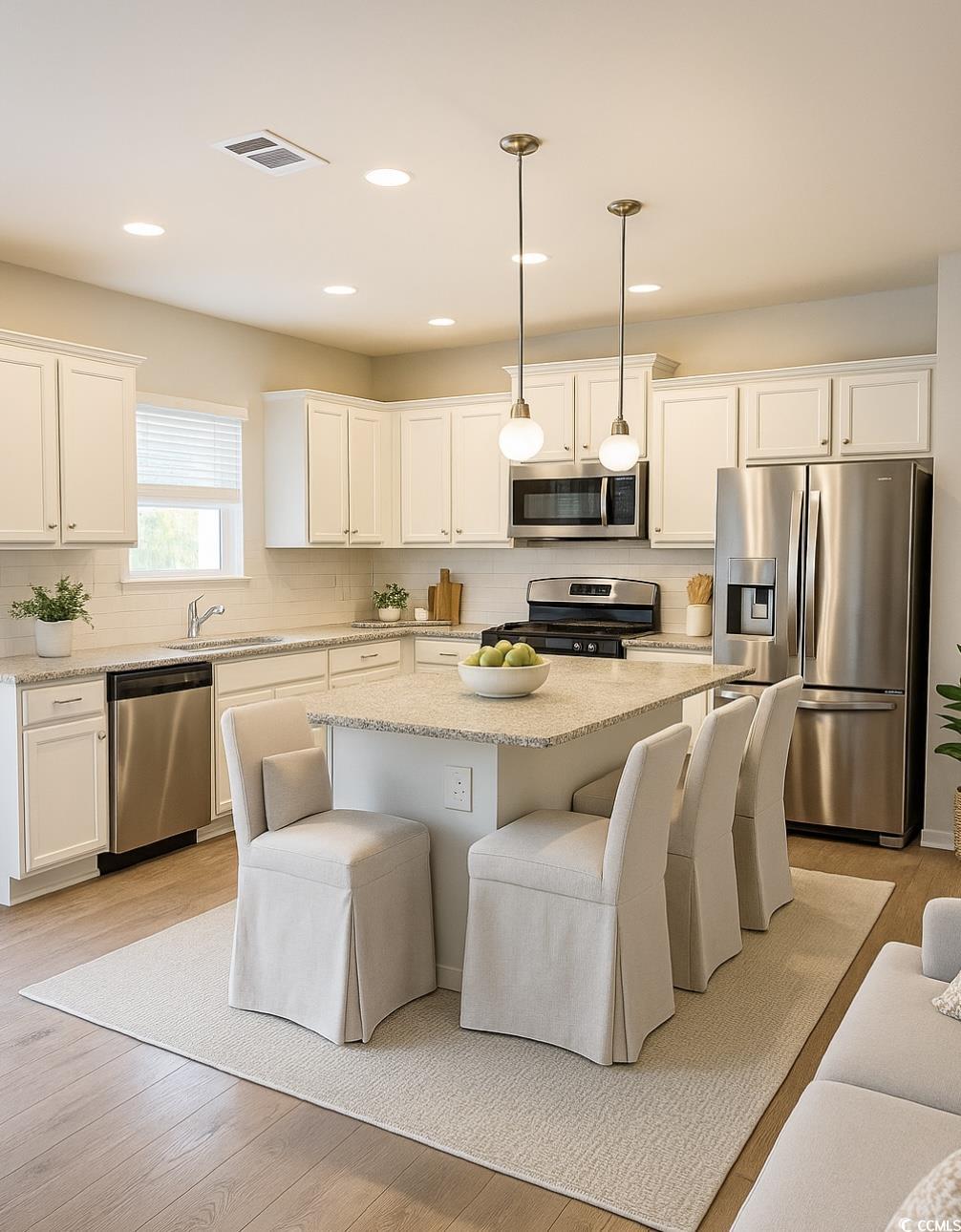 3320 Candytuft Drive Conway, SC 29526 - Photo 6 of 19 Kitchen featuring stainless steel appliances, backsplash, a kitchen bar, white cabinets, and recessed lighting