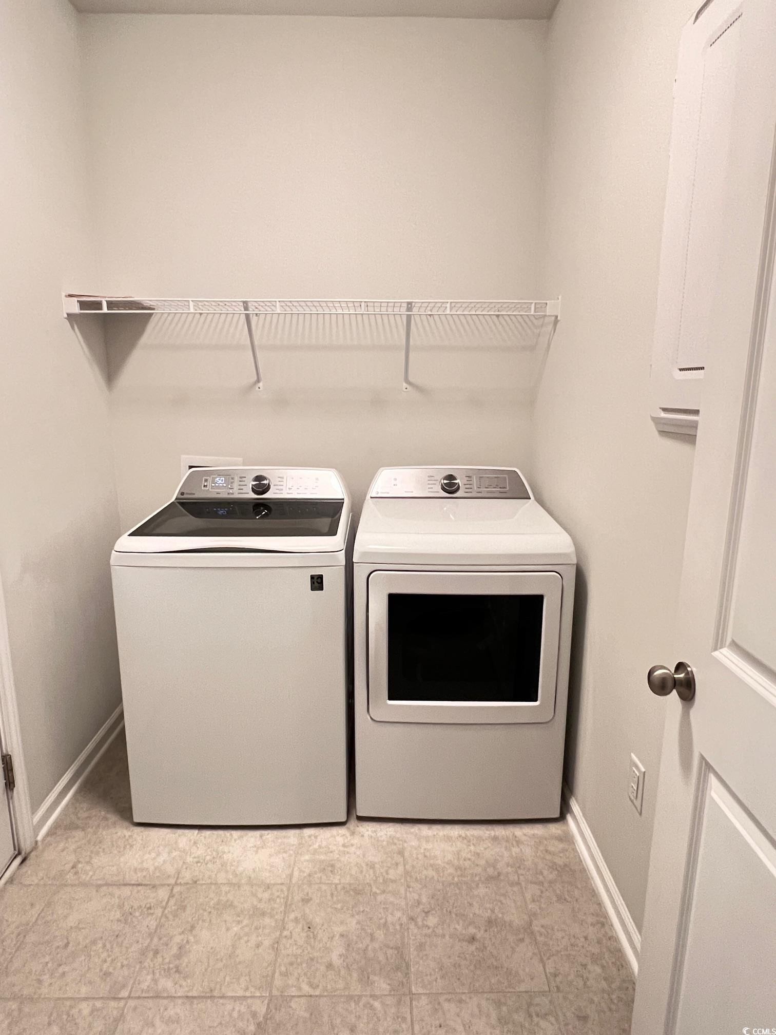 3320 Candytuft Drive Conway, SC 29526 - Photo 9 of 19 Laundry room featuring washer and dryer and light tile patterned floors
