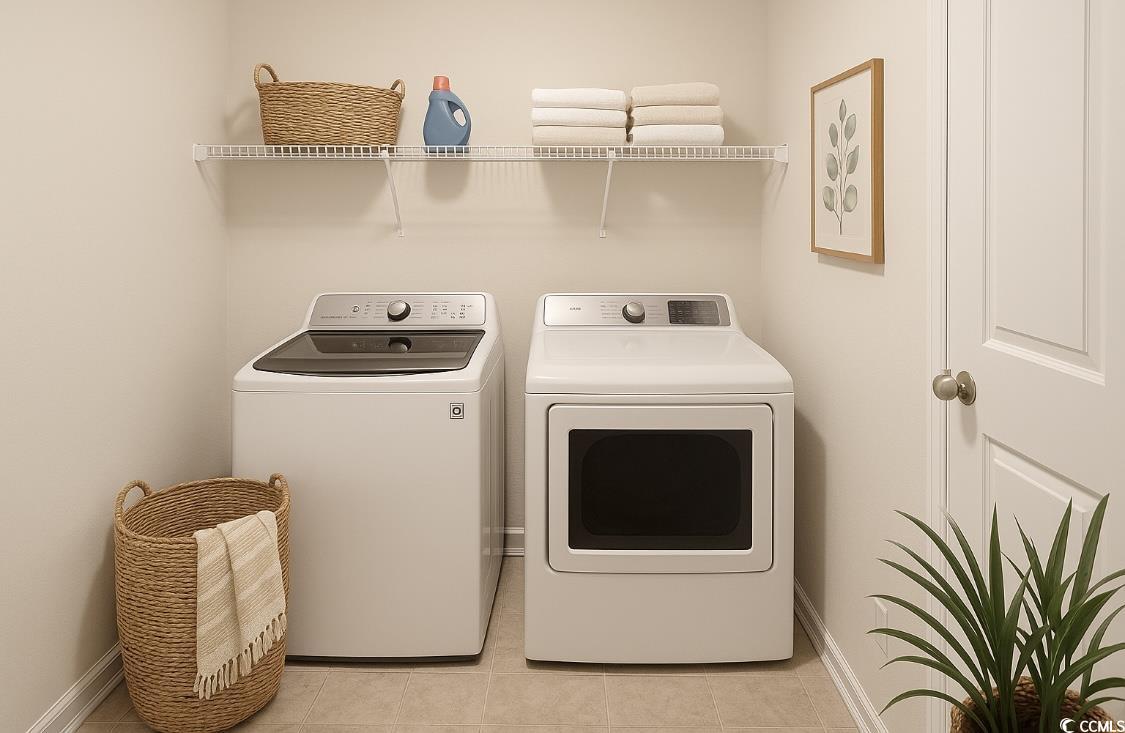 3320 Candytuft Drive Conway, SC 29526 - Photo 10 of 19 Washroom featuring washer and clothes dryer and light tile patterned floors