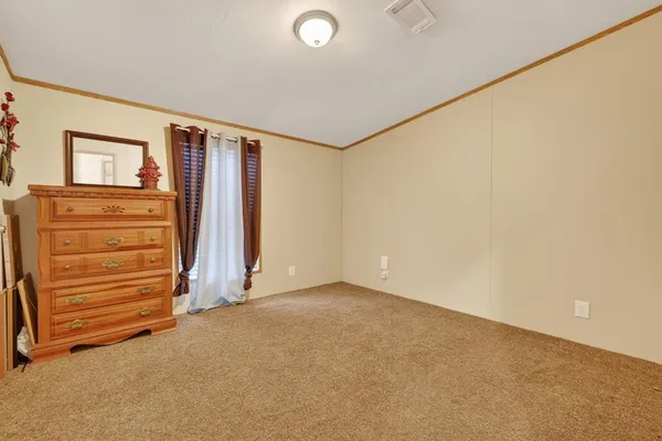 an empty room with a fireplace