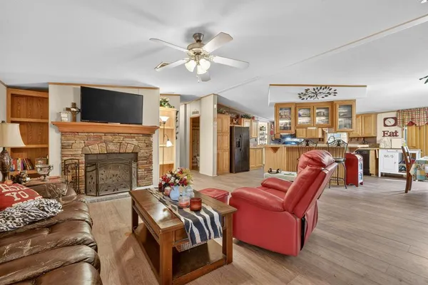 a living room with furniture and a fireplace
