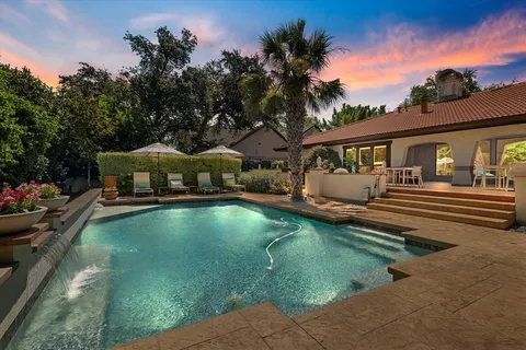 a swimming pool view with a swimming pool
