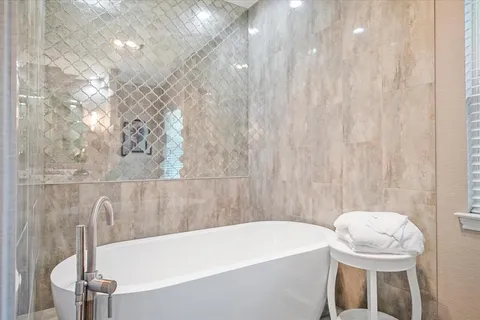 a bathroom with a sink a toilet and bathtub