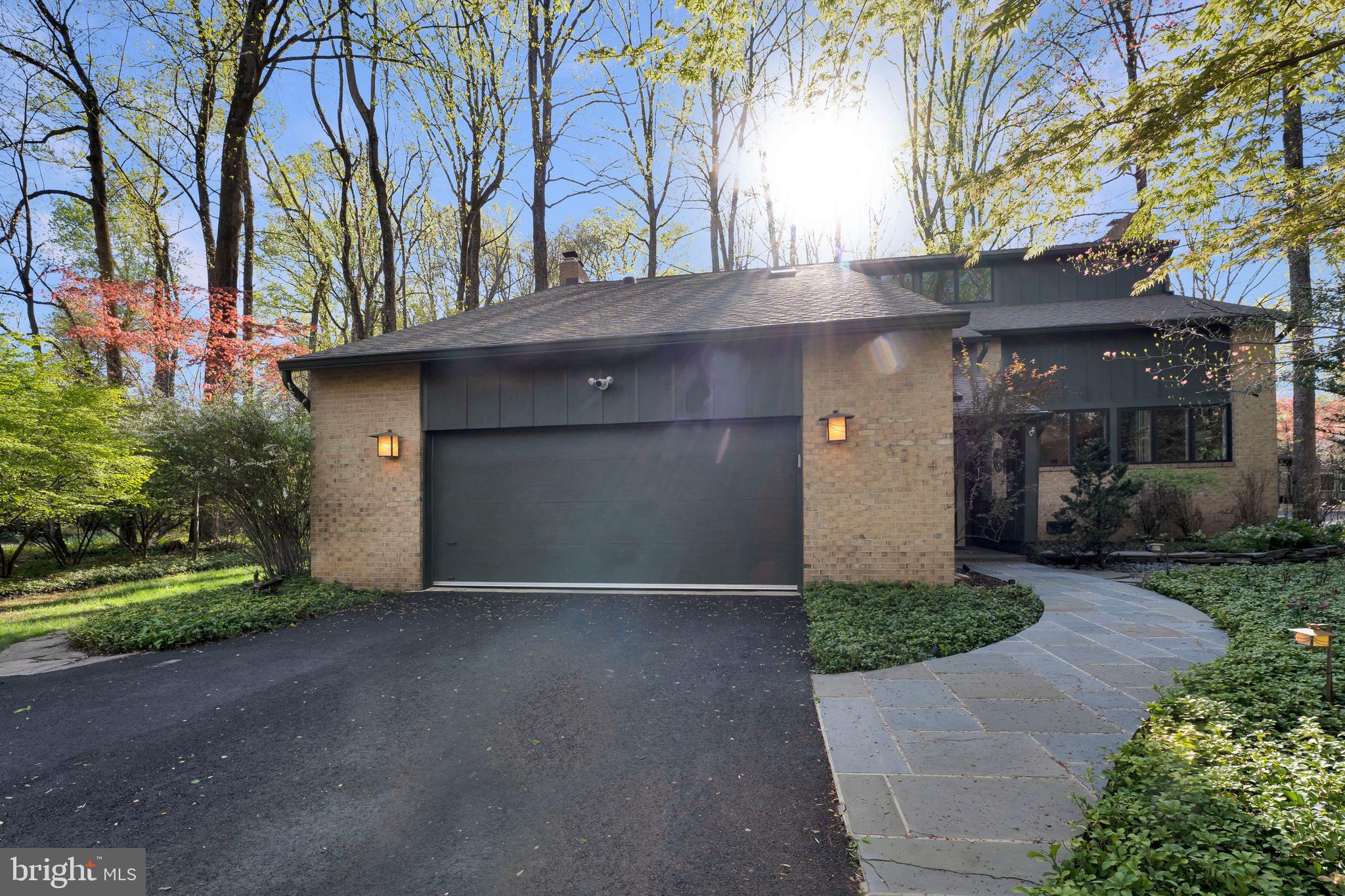3214 Foxvale Drive Oakton, VA 22124 - Photo 1 of 56 a front view of a house with a yard and garage