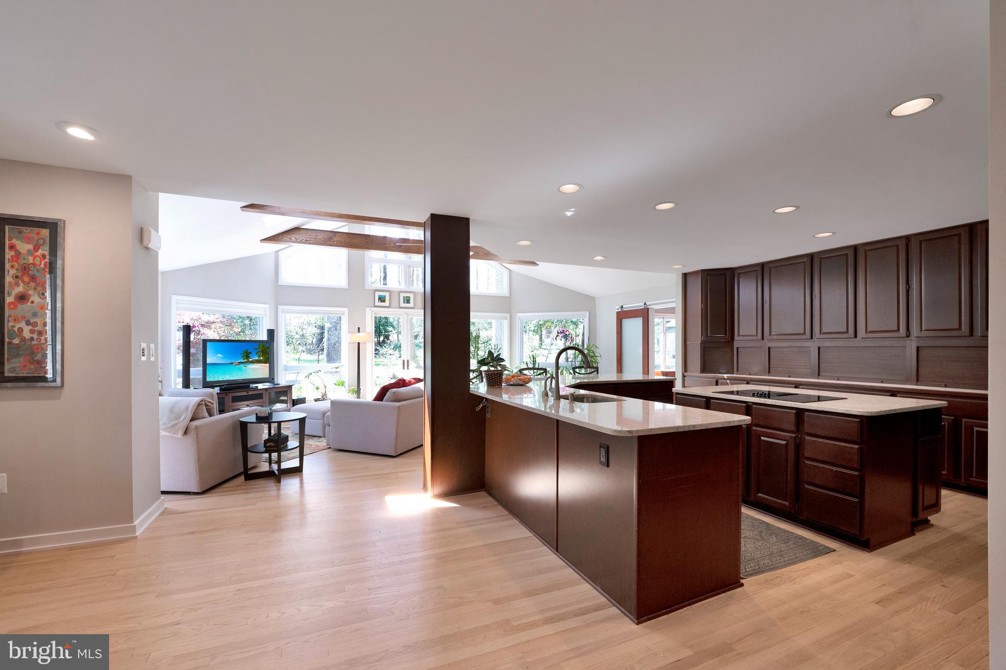 3214 Foxvale Drive Oakton, VA 22124 - Photo 11 of 56 a kitchen with stainless steel appliances granite countertop wooden floors and large window