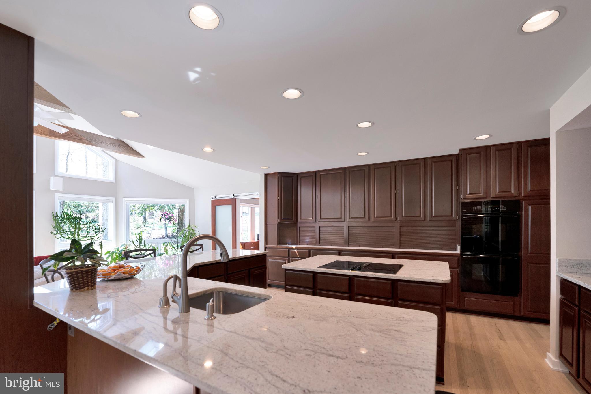 3214 Foxvale Drive Oakton, VA 22124 - Photo 12 of 56 a kitchen with stainless steel appliances granite countertop a sink refrigerator and cabinets