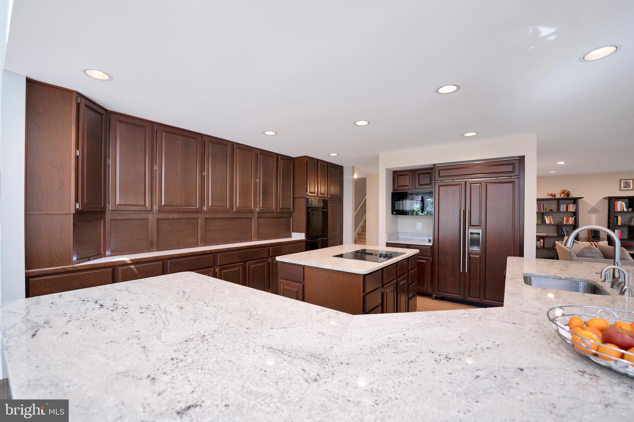 3214 Foxvale Drive Oakton, VA 22124 - Photo 13 of 56 a kitchen with stainless steel appliances kitchen island granite countertop a refrigerator and a sink