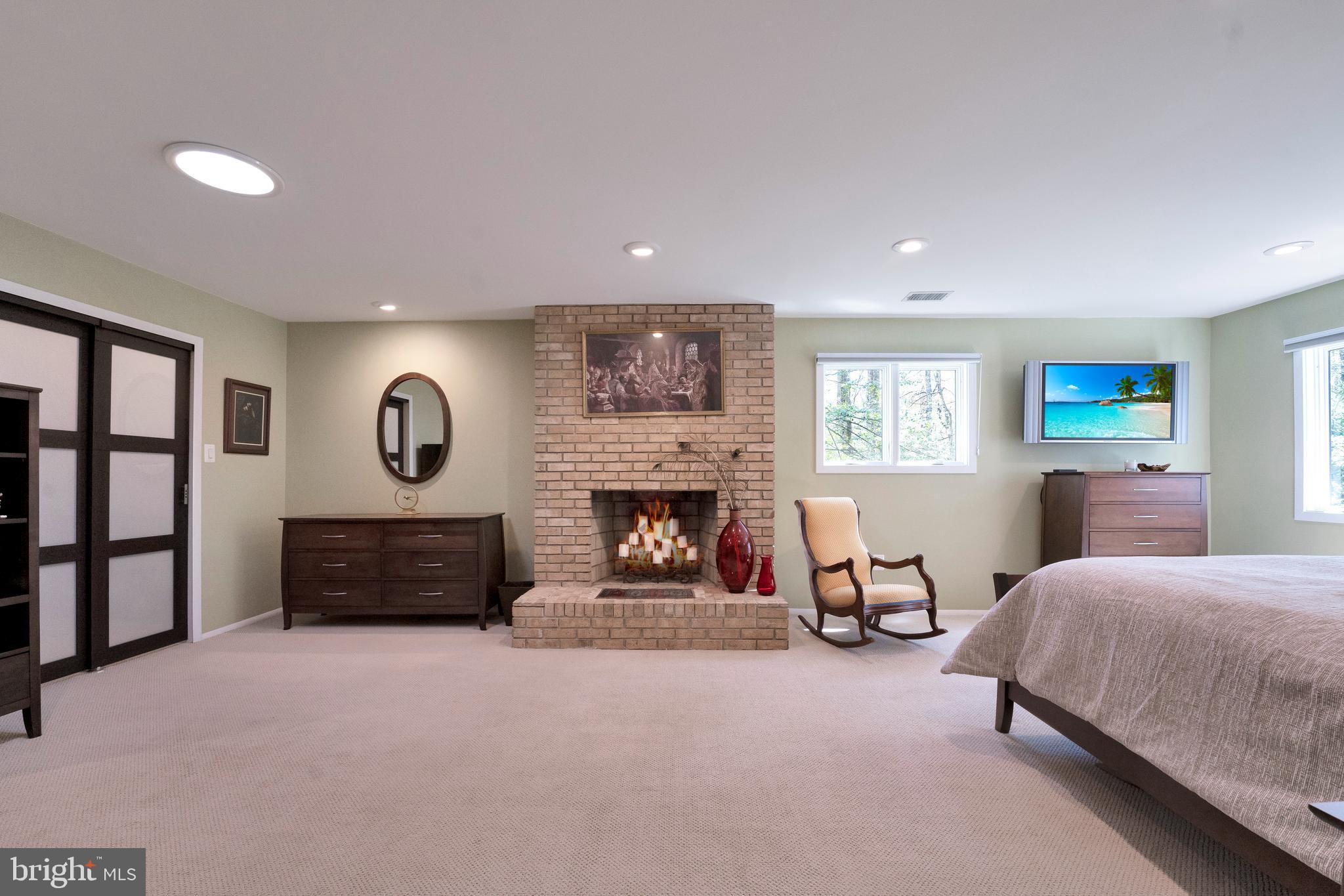 3214 Foxvale Drive Oakton, VA 22124 - Photo 26 of 56 a bedroom with furniture and a fireplace
