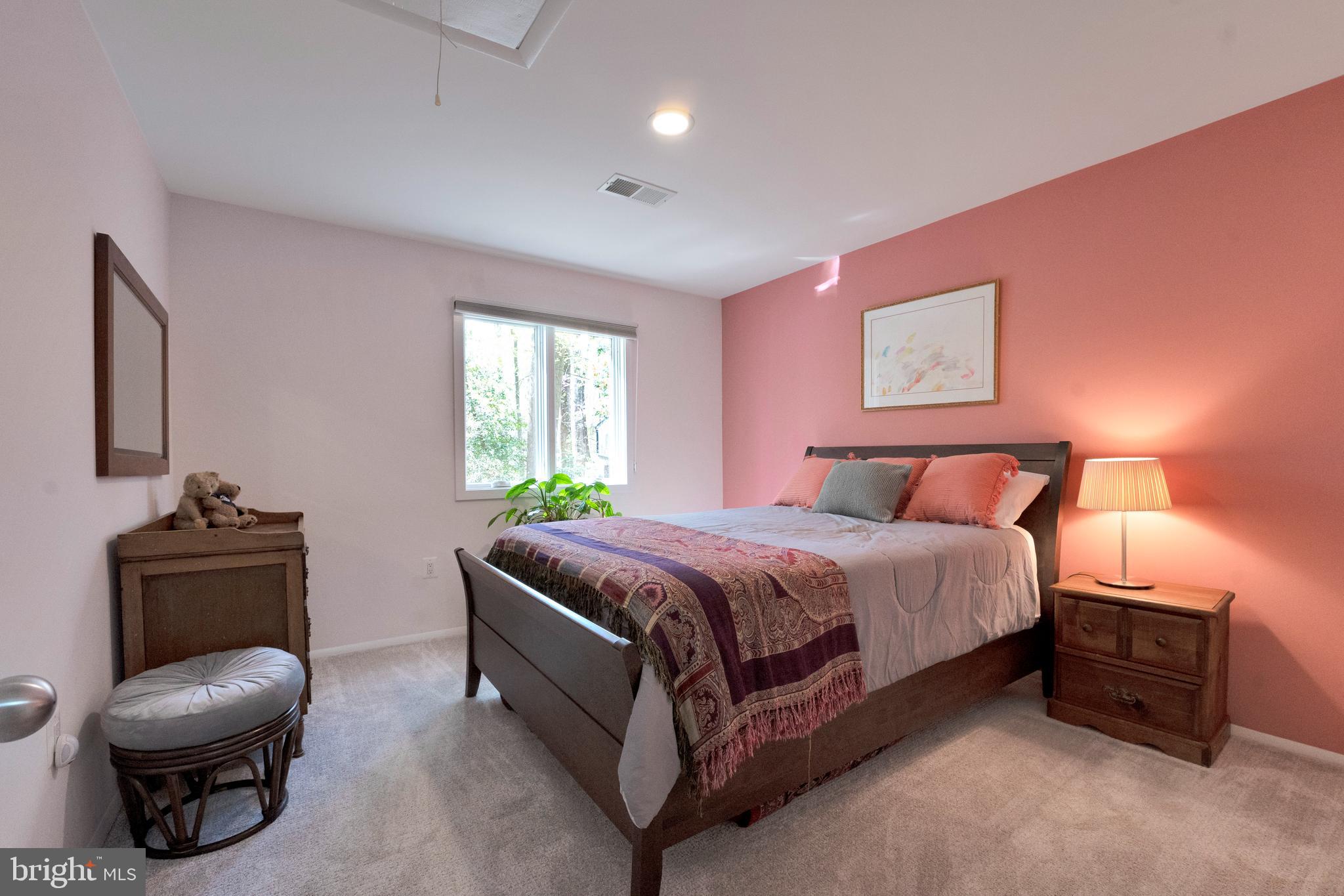 3214 Foxvale Drive Oakton, VA 22124 - Photo 30 of 56 a bedroom with a bed and a chair