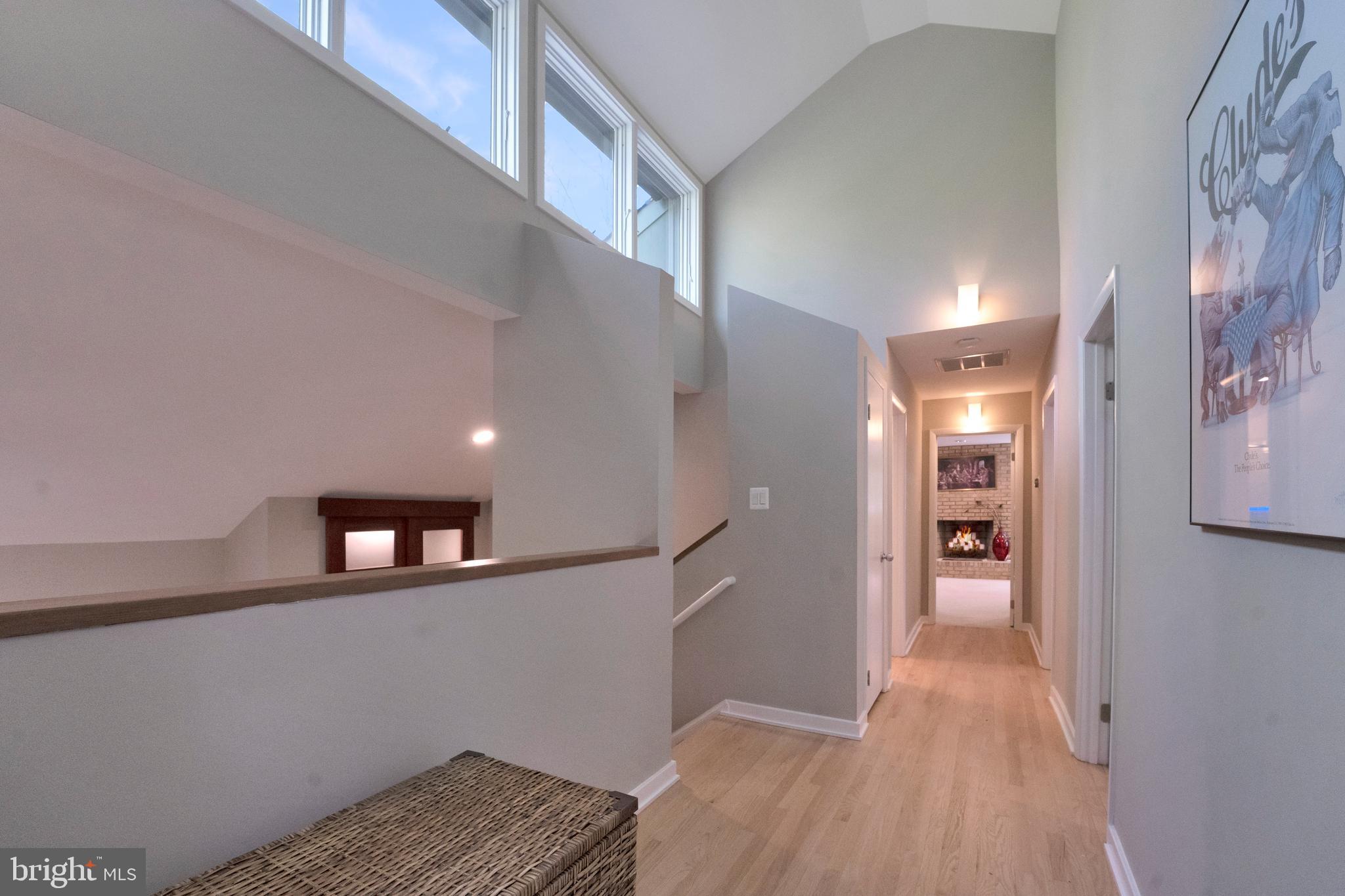 3214 Foxvale Drive Oakton, VA 22124 - Photo 34 of 56 a view of hallway with stairs and wooden floor
