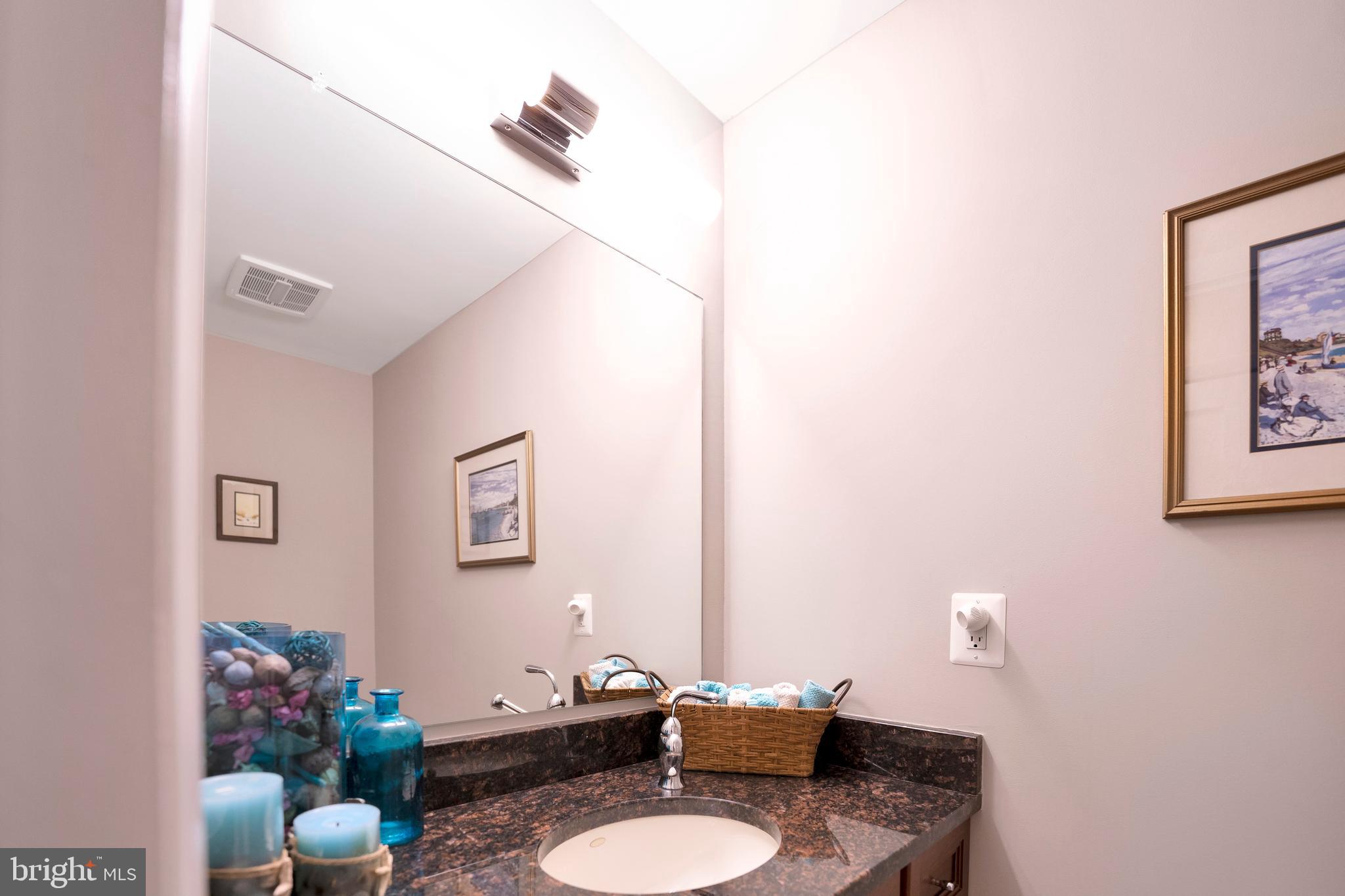 3214 Foxvale Drive Oakton, VA 22124 - Photo 37 of 56 a bathroom with a sink mirror and toilet