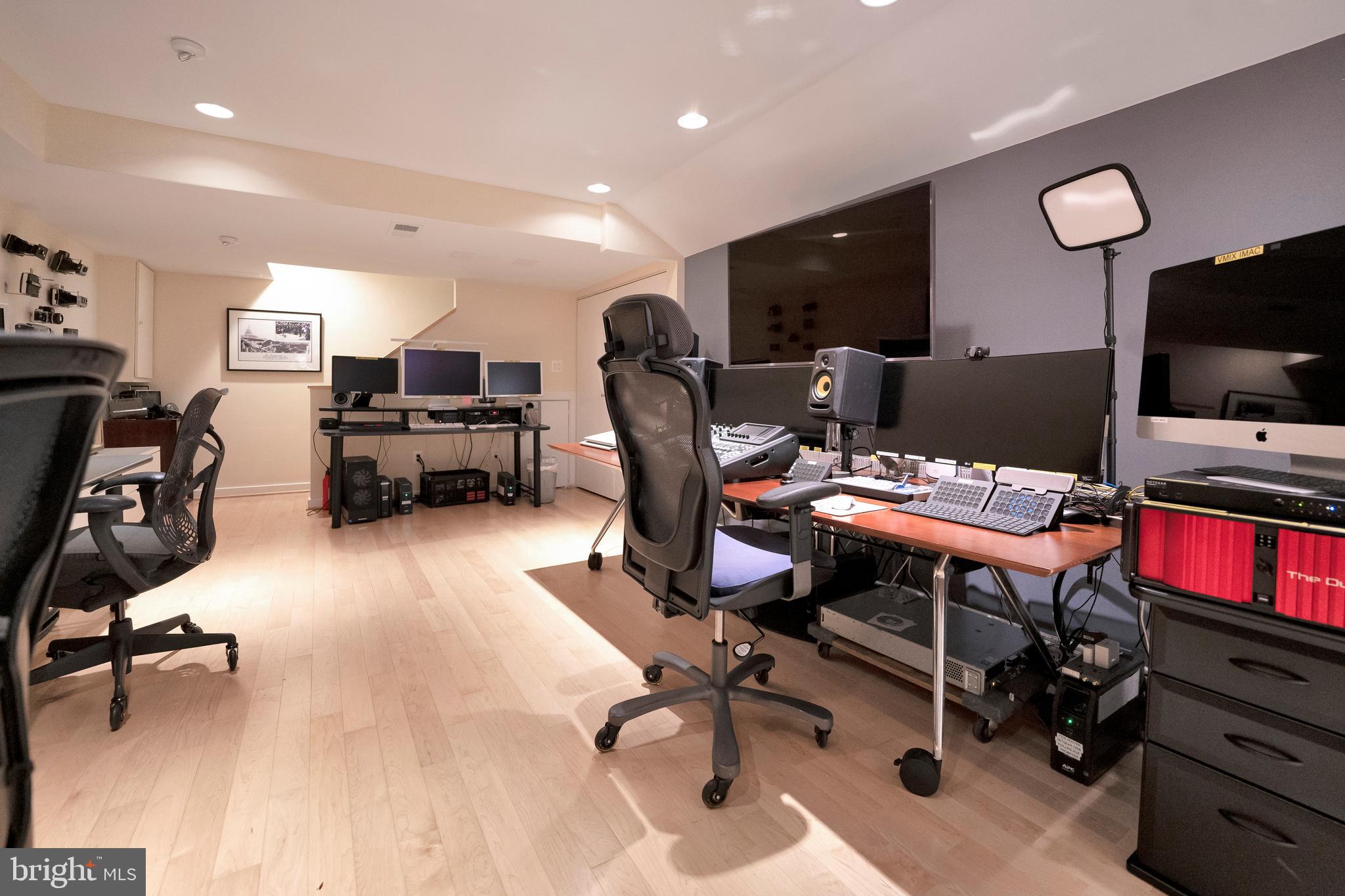 3214 Foxvale Drive Oakton, VA 22124 - Photo 38 of 56 a view of a workspace with furniture and a flat screen tv
